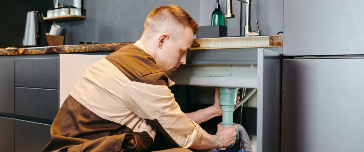 a-man-in-uniform-checking-plumbing-equipment-after-2021-09-24-03-42-54-utc.jpg